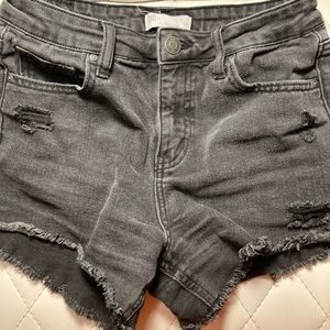 black ripped jean shorts